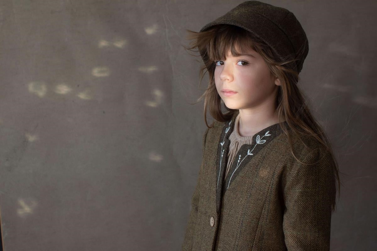 42.2 Green woollen hat with strap.-Popelin