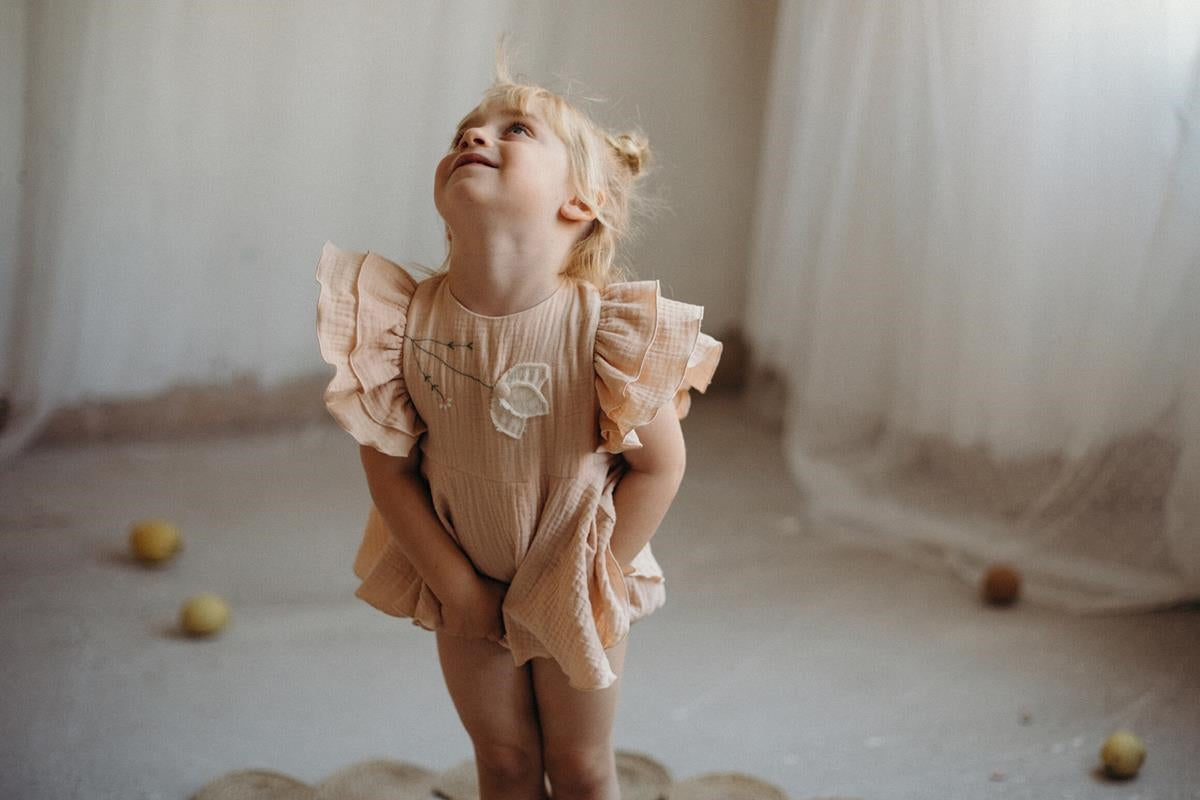 Organic pink romper suit with cape-style skirt-Popelin